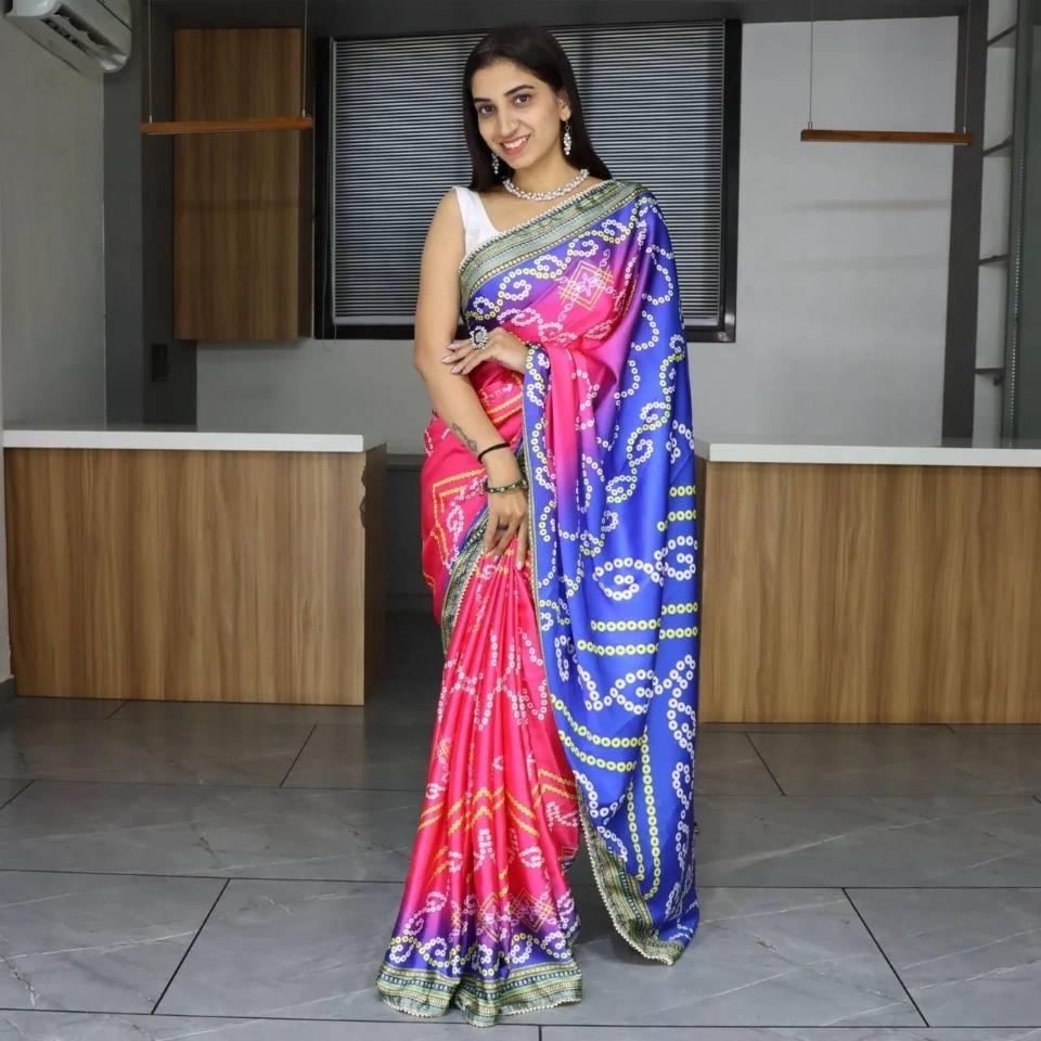 FlexFeb Bandhani Print Pure Japan Satin Saree in Pink & Blue with Pearl Lace Border – Traditional Festive Drape with Unstitched Blouse