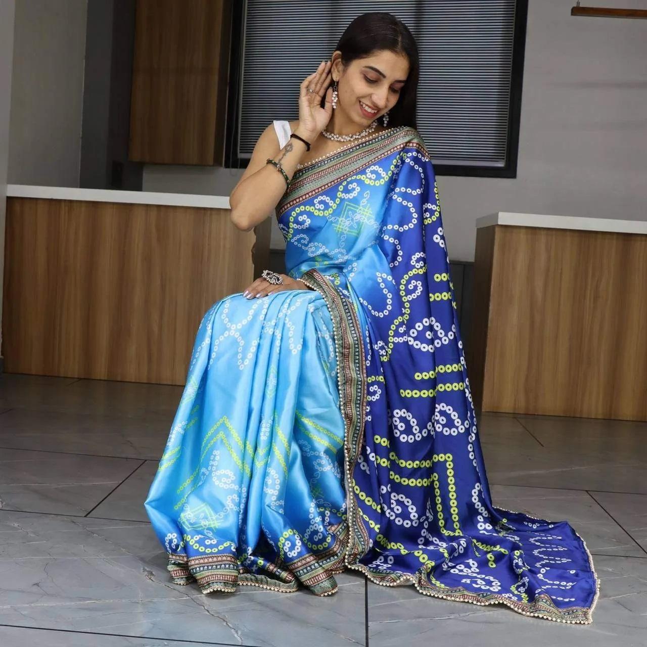 FlexFeb Sky Blue Bandhani Print Japan Satin Saree with Traditional Border – Elegant Festive Drape with Unstitched Blouse