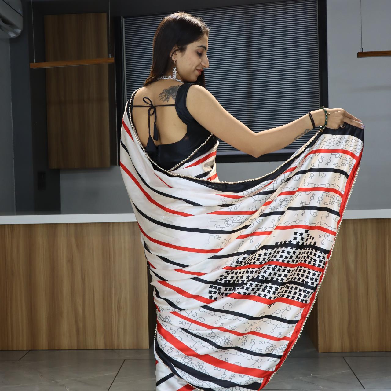 FlexFeb Modern Striped Japan Satin Saree in White, Red & Black with Pearl Lace Border – Stylish Party Drape with Unstitched Blouse