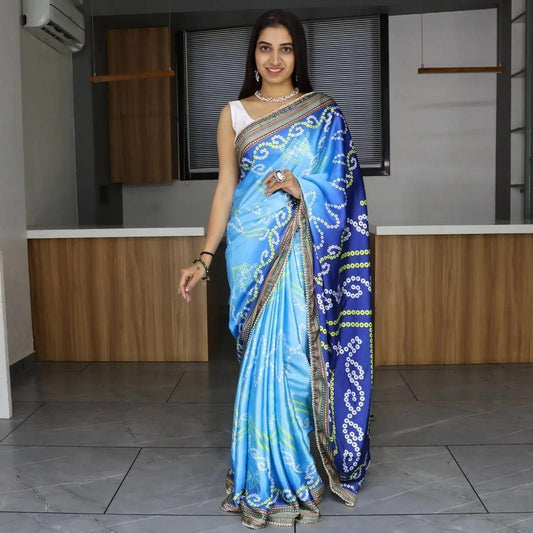FlexFeb Sky Blue Bandhani Print Japan Satin Saree with Traditional Border – Elegant Festive Drape with Unstitched Blouse